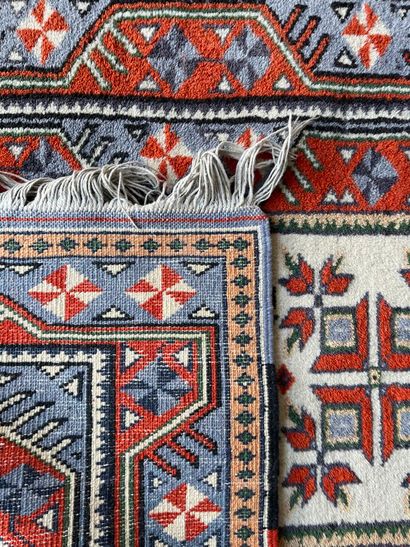 Lot including four carpets: 
- A tappis with...