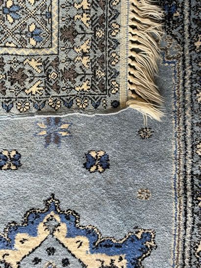 Lot including four carpets: 
- A tappis with...