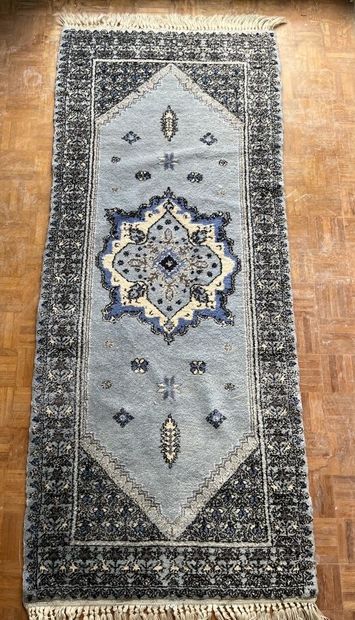 Lot including four carpets: 
- A tappis with...