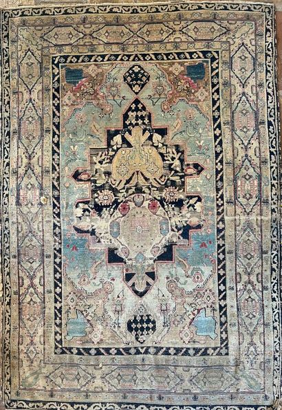Oriental rug decorated with flowers and stylized...
