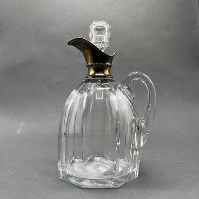 Cut crystal decanter with silver mounting...