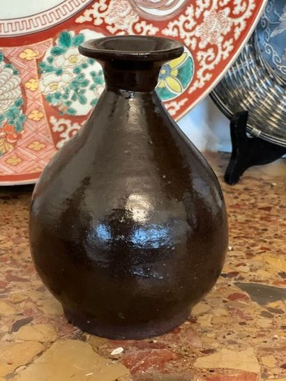 Brown-glazed stoneware vase with narrow neck...