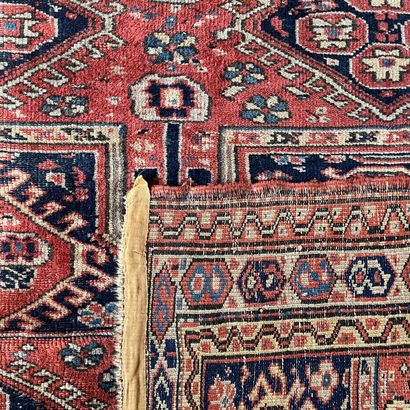 Oriental rug with red background and blue...