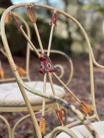 Four chairs in lacquered wrought iron. Back...