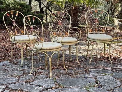 Four chairs in lacquered wrought iron. Back...