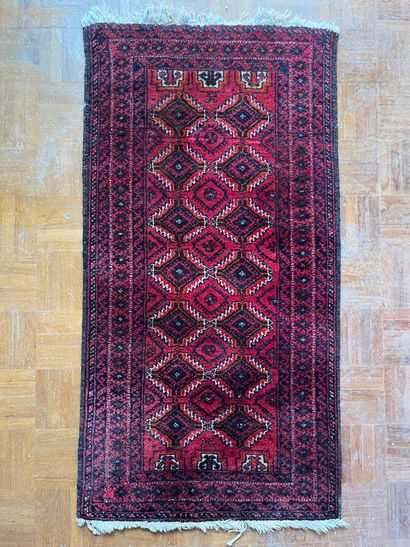 Lot including four carpets: 
- A tappis with...