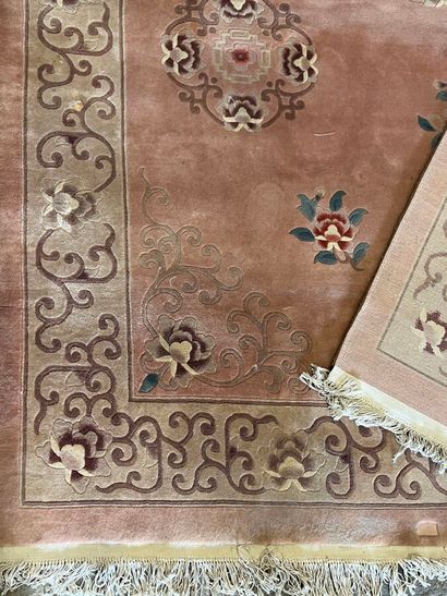 Chinese-style rug with pink background (worn,...
