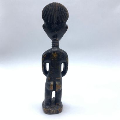Carved wooden statuette representing a female...