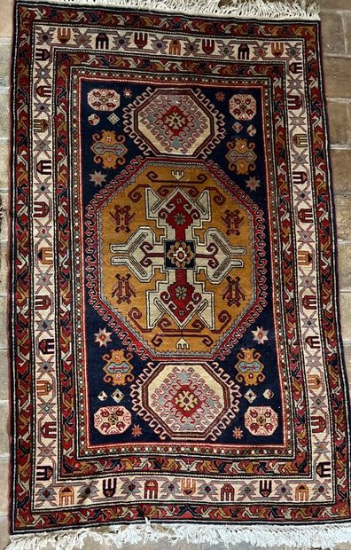 Oriental rug with blue background and three...