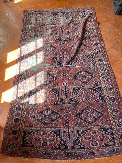 Oriental rug with red background and blue...
