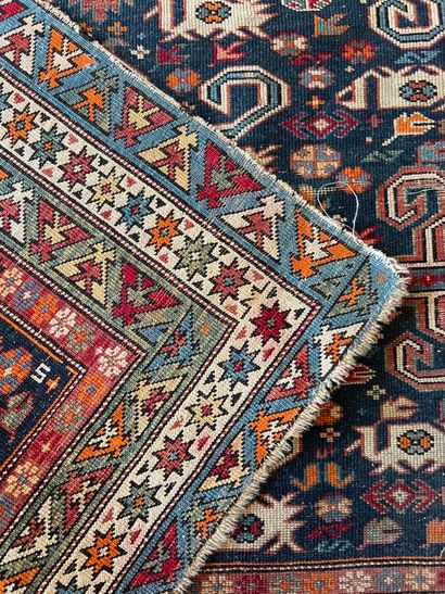 Small oriental rug with blue background and...