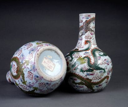 Pair of porcelain bottle vases with polychrome...