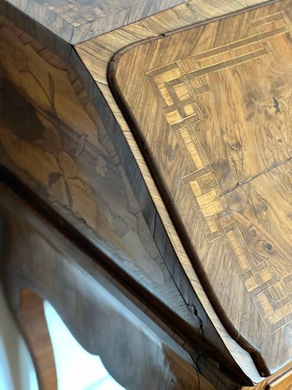 Wood veneer sloping desk opening with a flap...