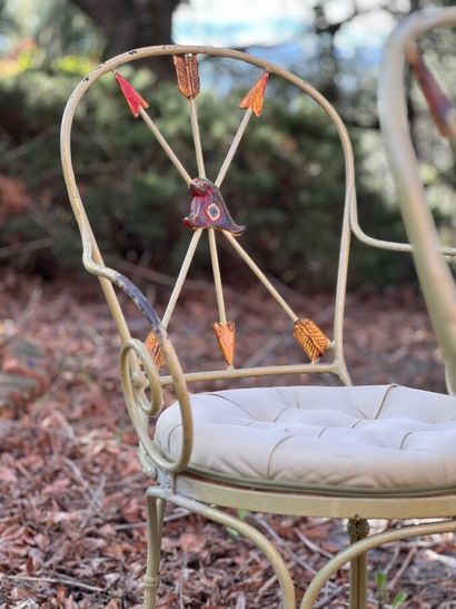 Four chairs in lacquered wrought iron. Back...