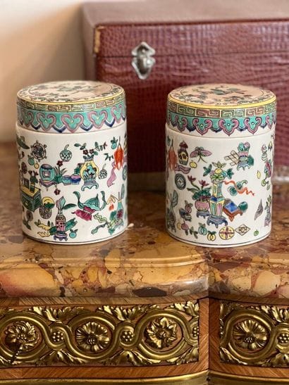 Pair of porcelain covered pots with polychrome...
