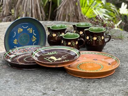 Four Provencal earthenware dishes and pourers...