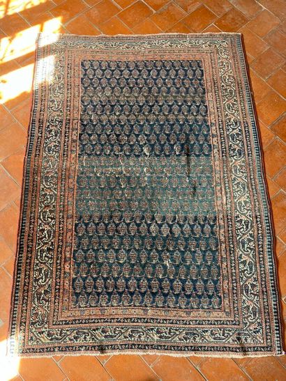 Oriental rug with blue background and stylized...