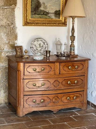 Cherry-wood arched chest of drawers opening...