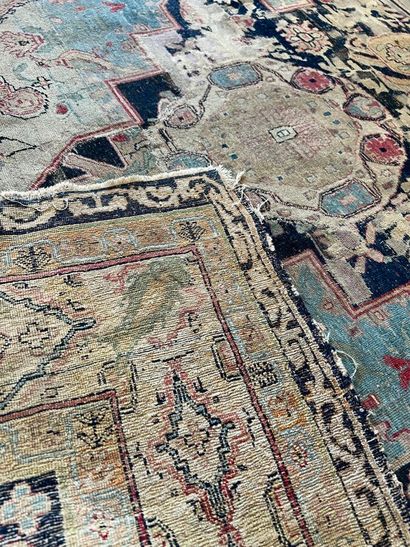 Oriental rug decorated with flowers and stylized...