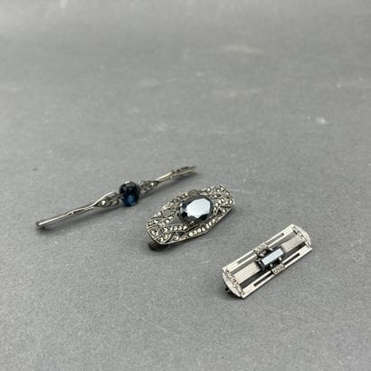Three brooches adorned with rhinestones and...