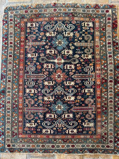 Small oriental rug with blue background and...