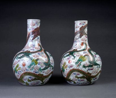 Pair of porcelain bottle vases with polychrome...