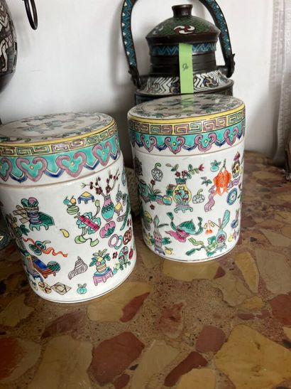 Pair of porcelain covered pots with polychrome...
