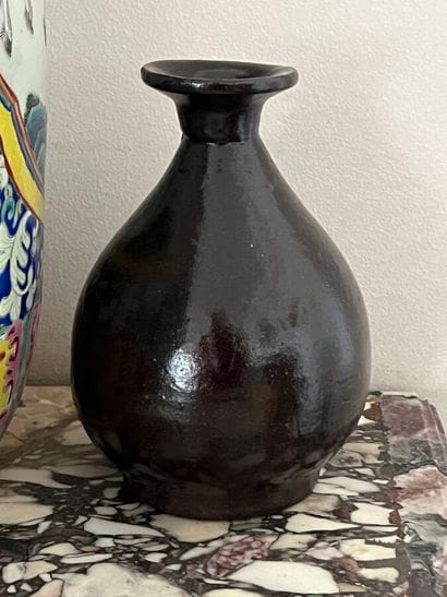 Brown-glazed stoneware vase with narrow neck...