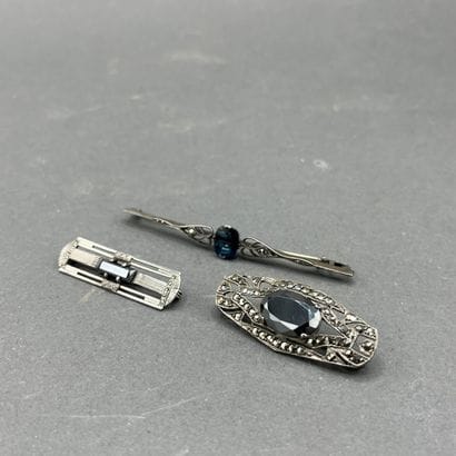 Three brooches adorned with rhinestones and...