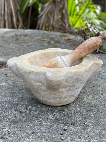 Marble mortar and wooden pestle. 
Width :...