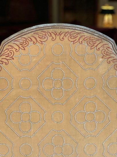 Carved and gilded wooden sofa, decorated...