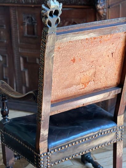 Armchair in natural wood, the uprights surmounted...