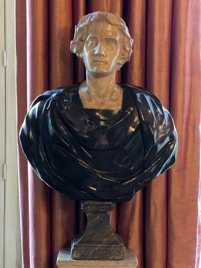 Bust on pedestal carved in white and gray...