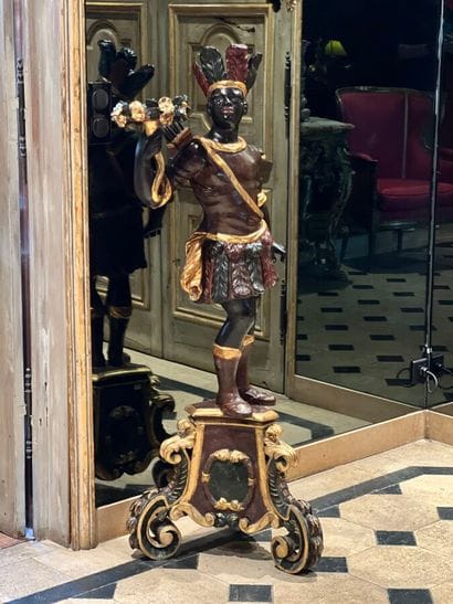 Pair of polychrome and gilded carved wood...