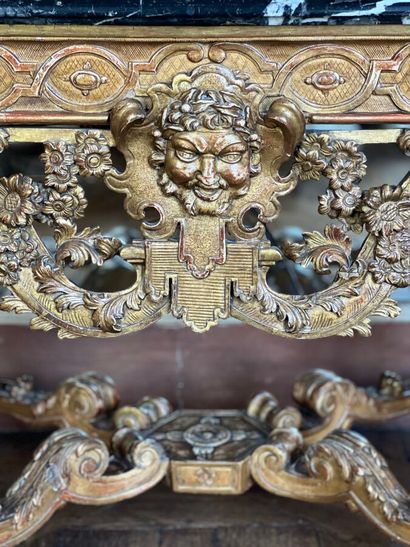 A gilded and varnished wood game console...