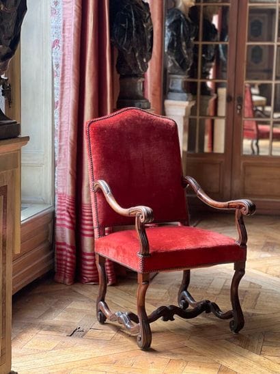 Armchair in carved natural wood, with curved...