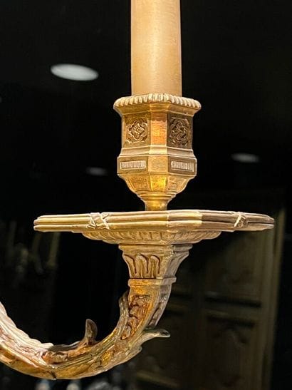Pair of three-light bronze sconces adorned...