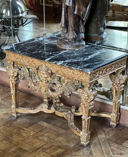 A gilded and varnished wood game console...