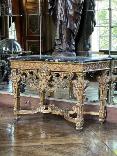 A gilded and varnished wood game console...