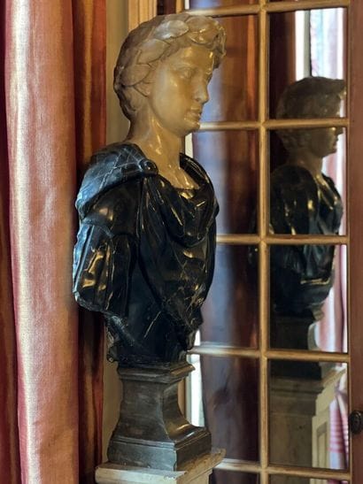 Sculpted pedestal bust in white and gray...