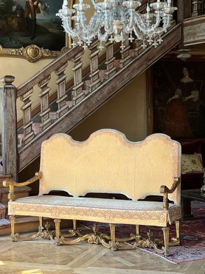 Carved and gilded wooden sofa, decorated...