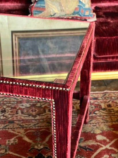 Wooden end table covered with purple velvet....
