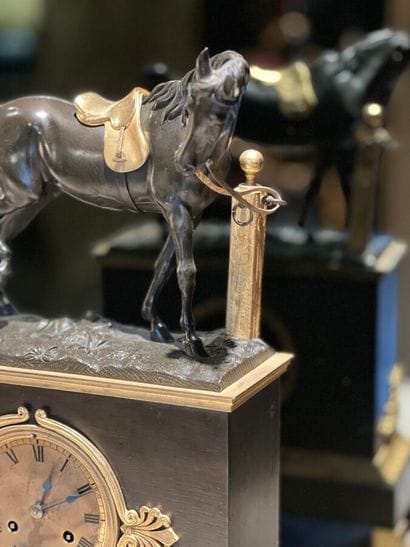 Patinated and gilded bronze clock decorated...
