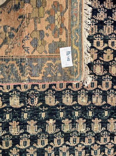 Oriental rug with blue background, geometric...