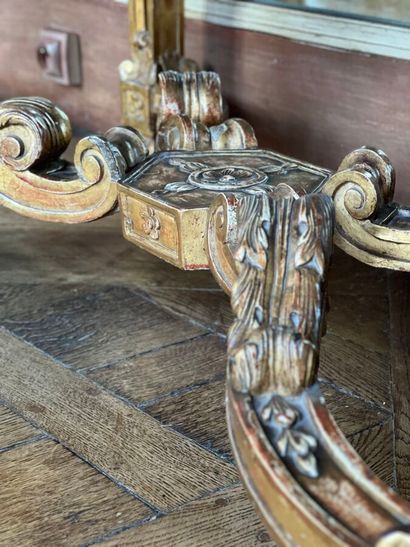 A gilded and varnished wood game console...