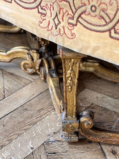 Carved and gilded wooden sofa, decorated...
