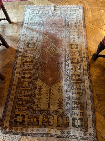Oriental beige carpet with cream border centered...