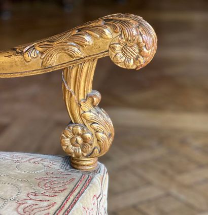 Carved and gilded wooden sofa, decorated...