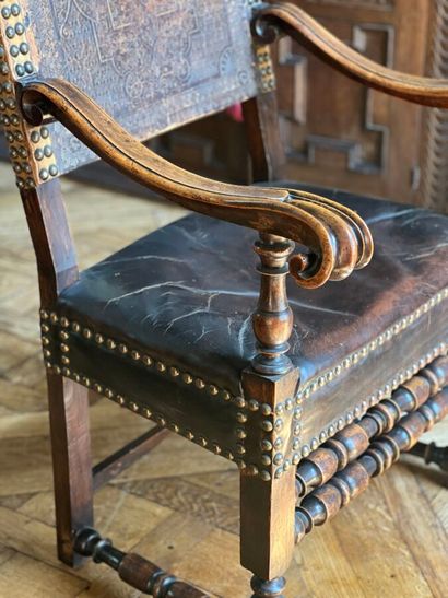 Armchair in natural wood, the uprights surmounted...
