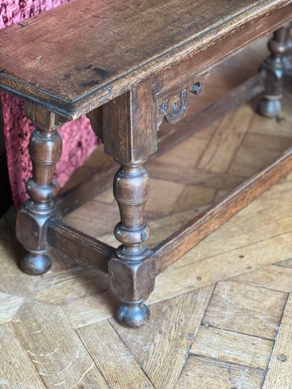 Natural wood bench decorated with carved...